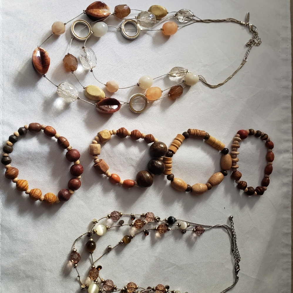 2 brown necklaces with 4 brown wooden bracelets